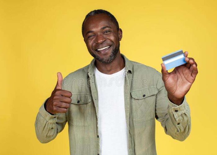 happy-adult-african-american-man-casual-showing-thumb-up-credit-card-approves-finances-savings-isolated-yellow-255277503 happy-adult-african-american-man-casual-showing-thumb-up-credit-card-approves-finances-savings-isolated-yellow-255277503